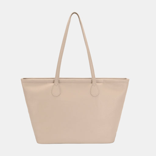 Front view of a beige leather tote bag with long handles and sleek minimalist design