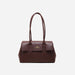 Front view of a dark brown leather shoulder bag featuring a classic turn-lock closure and structured silhouette on a white background