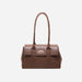 Front view of a structured brown leather handbag with double handles and gold-tone turn-lock closure, set against a white background
